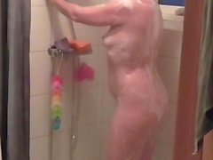 Perfect asses in the shower caught on a voyeur spy cam